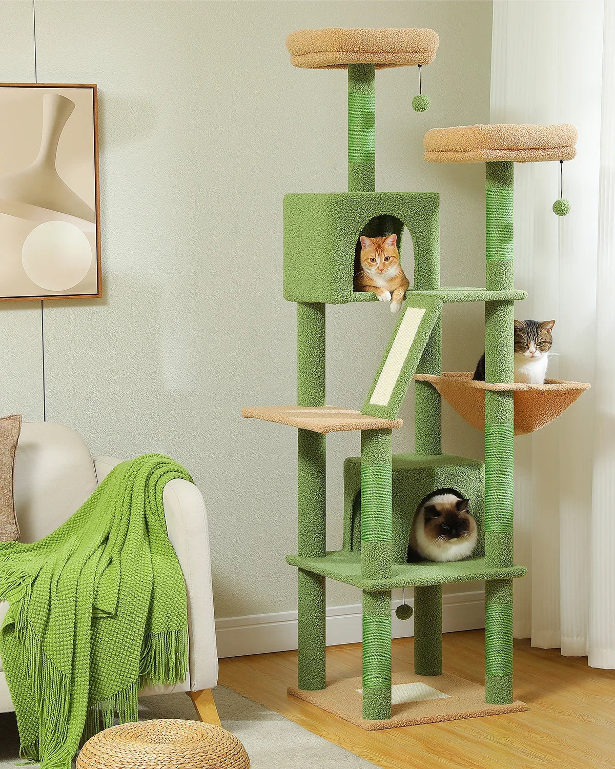 Green cat tree with multiple levels and a cat sitting on one of the platforms in a room.