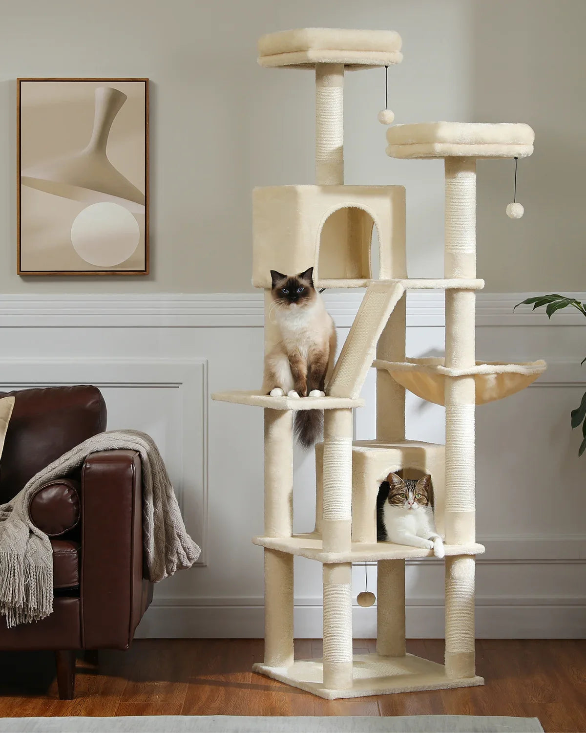 Cat tree with two cats in a living room setting