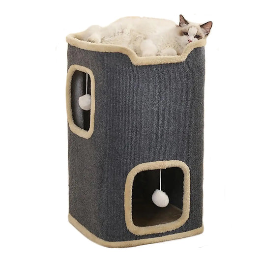 Cat sitting on a gray and beige cat tree with a white background
